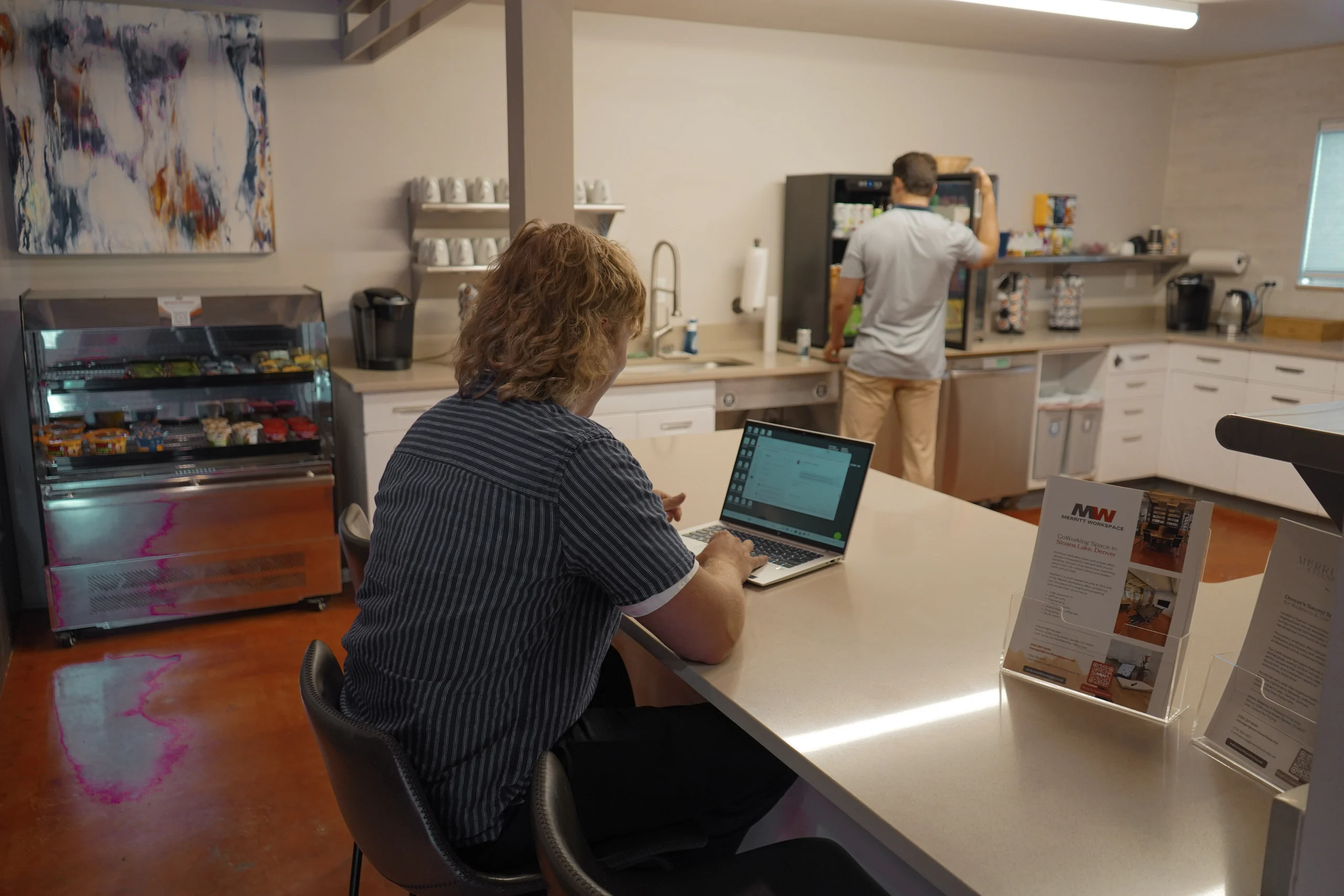 The snackshop case and kitchen counter at Merritt Workspace, a coworking space in Sloan's Lake, Denver