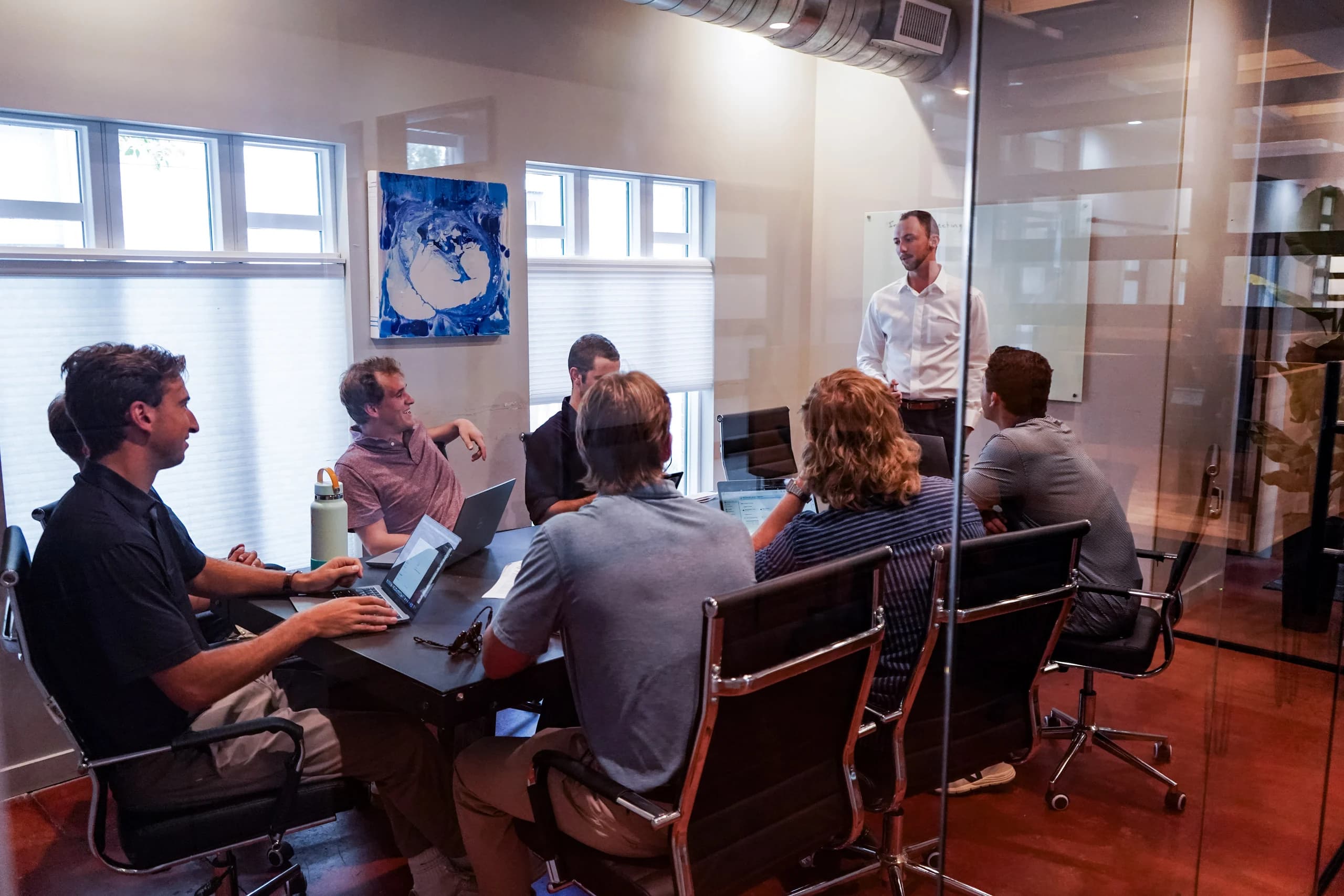 A team meeting in the conference room at Merritt Workspace coworking in Sloan's Lake, Denver